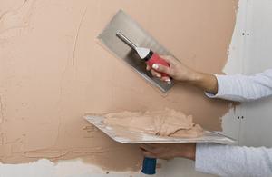 plastering the wall