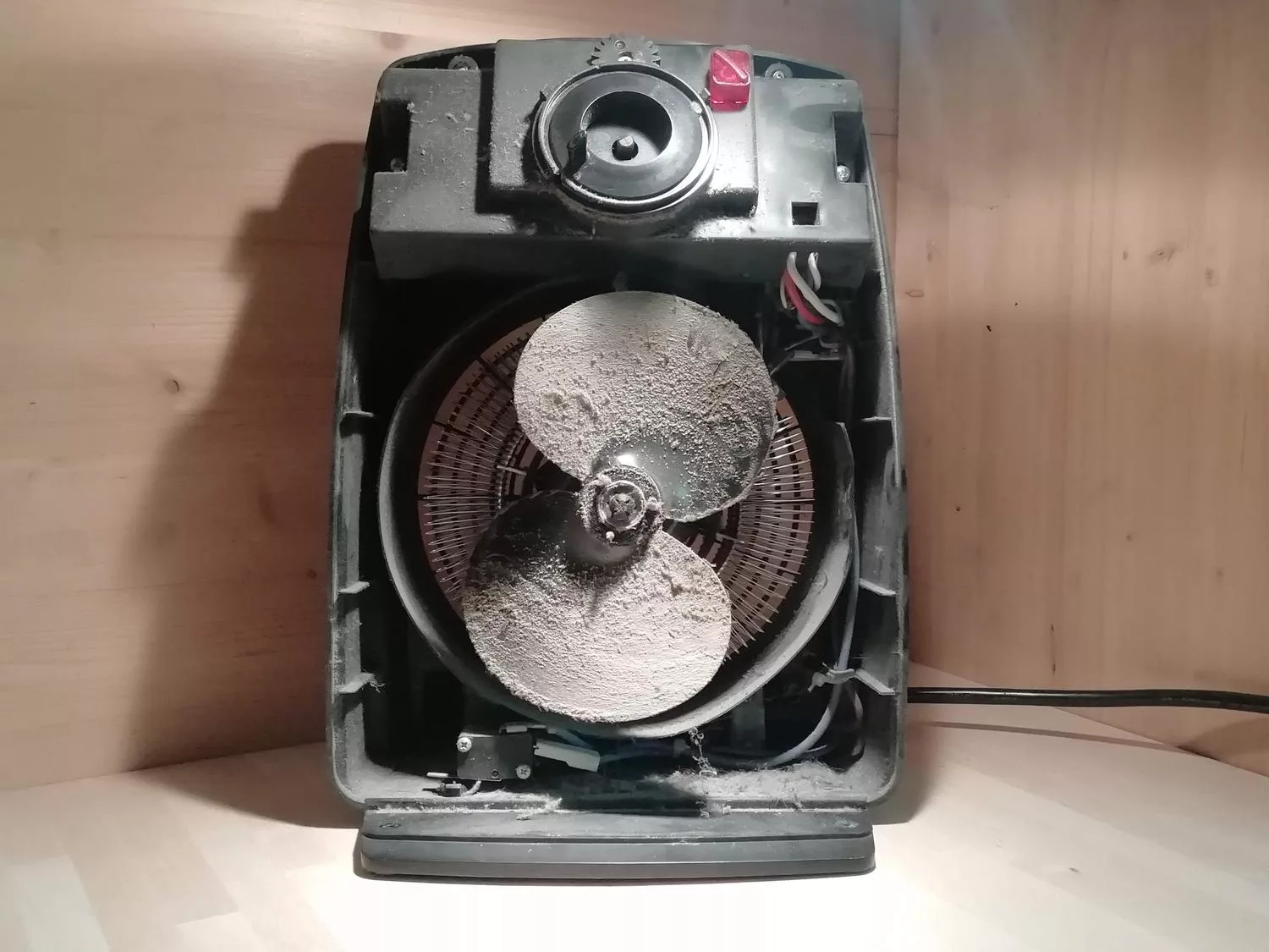 Internal cleaning of the convector heater with a vacuum and brush